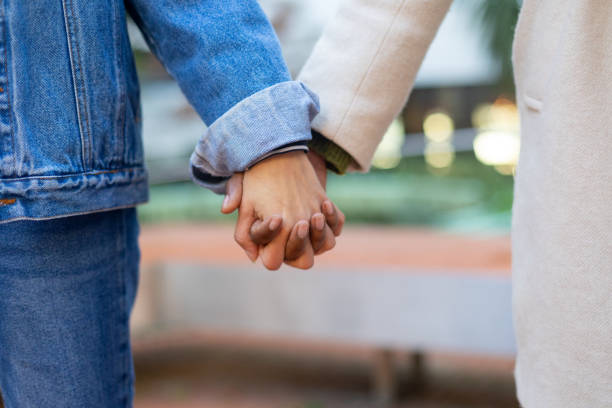 Couple holding hands